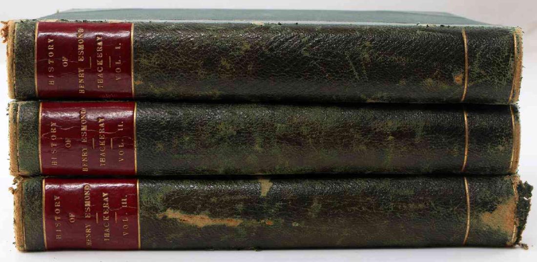 WILLIAM THACKERAY HISTORY OF HENRY ESMOND VOLS 1-3: Early editions of William Thackeray's History of Esmond novels. Volumes I-III. Books are in good condition with some slight damage to binding. Each measures approximately 7.5 inches by 5 inches.