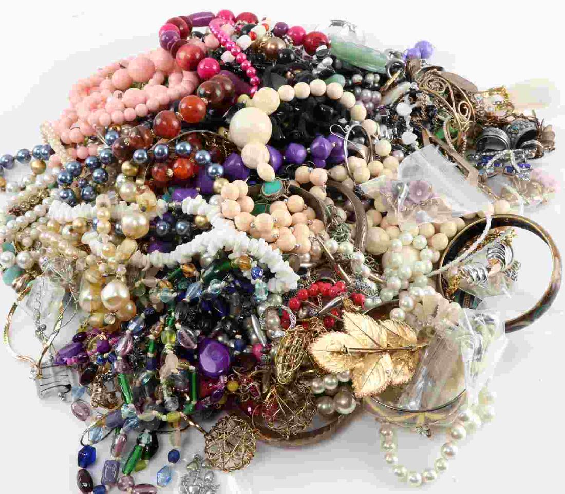 6.8 POUNDS OF MIXED COSTUME JEWELRY BEADS VARIETY: Many beaded items, bracelets, necklaces, earrings, one freshwater pearl and jade bracelet, clip-on earrings and more. Good condition.