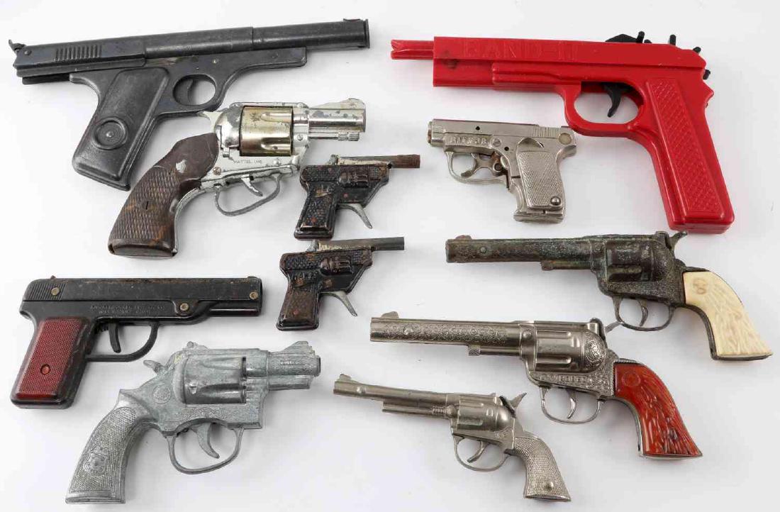 LOT OF 10 ANTIQUE MATTEL & OTHER TOY CAP GUNS: Grouping of antique Mattel & other toy cap guns of classic American brands with models such as "rodeo" & "Trooper" "38 snub" . Items are in good condition for their age with consistent patination & ox