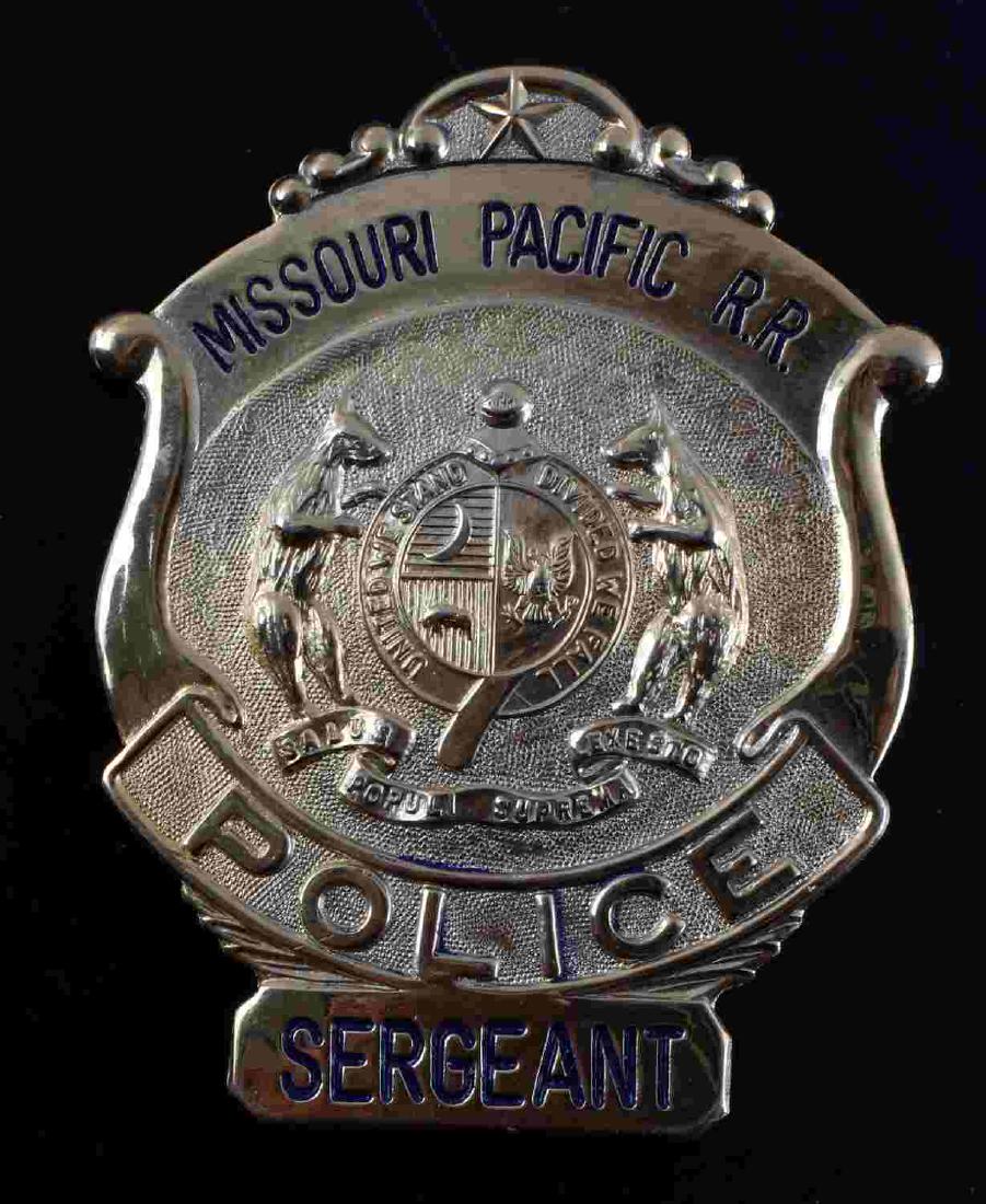 OBSOLETE MISSOURI PACIFIC RAILROAD POLICE BADGE: Missouri Pacific RR Sergeant police badge. Very good condition overall. Some discoloration present. Measures 3-1/8" X 2-3/8". Unmarked on reverse.