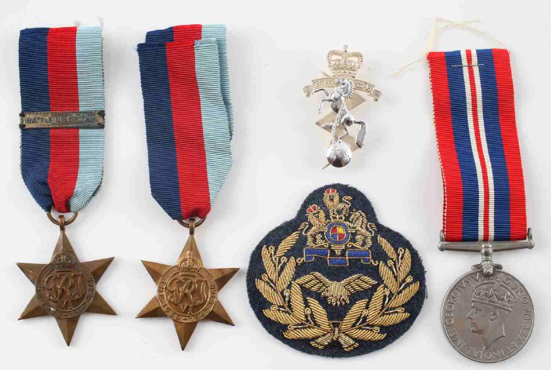 WWII BRITISH COMMONWEALTH MEDAL & BADGE LOT OF 5: This lot includes 2 1939-1945 Star medals (1 with Battle of Britain clasp,) 1 named Royal Electrical & Mechanical Engineers cap badge, 1 1939-1945 medal, and 1 Commonwealth Air Force patch. Good to ve