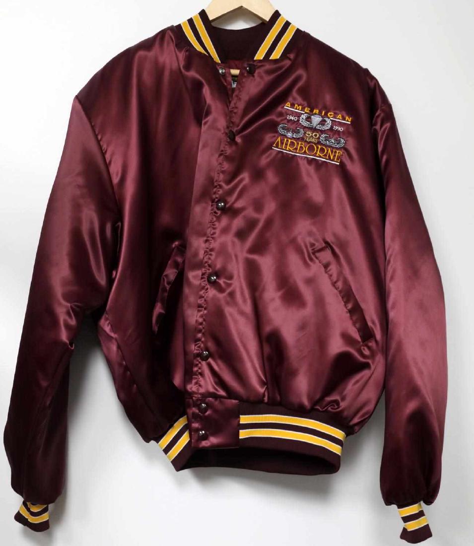 WWII US AIRBORNE 50 YEAR COMMEMORATIVE JACKET: Quarter Master Long Beach California made American 50 year Airborne commemorative jacket. 100% nylon exterior and 100% quilt interior. Size: XL. Used but in near new condition. This lot has a reserve.