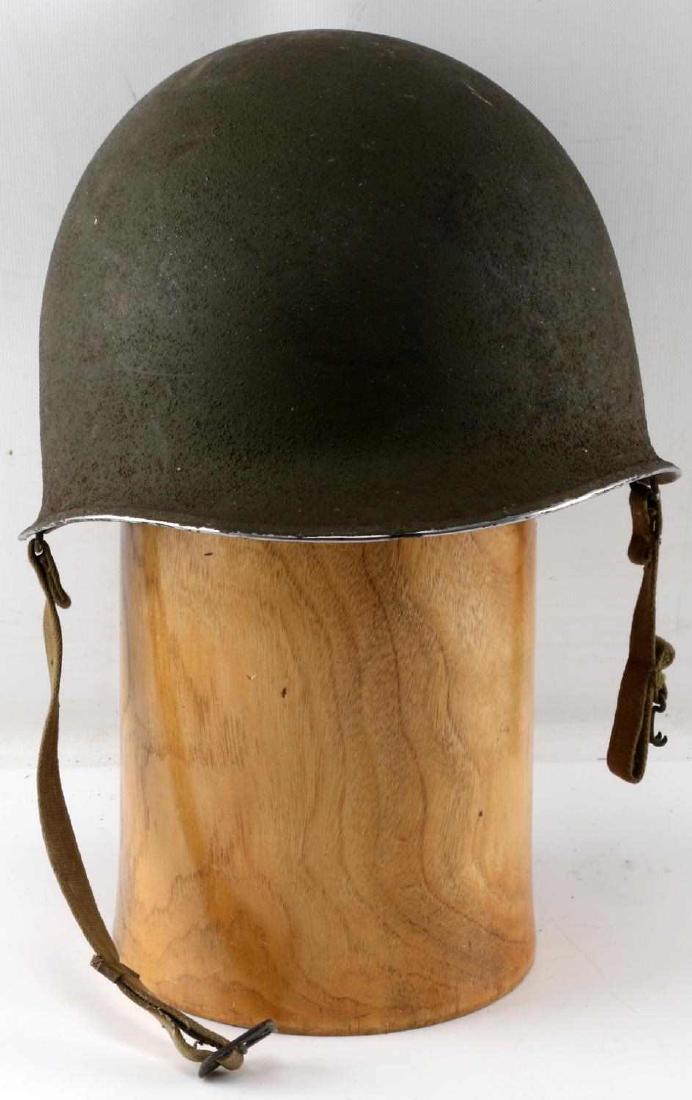 NAMED WWII US AMERICAN INFANTRY M1 HELMET: WWII front seam M1 helmet. Intact shell, liner, and sewn-in chinstrap. The name "Richard E. Flood" and the number "0-4145124" had been inked on the shell. Good condition with some paint loss and surfa