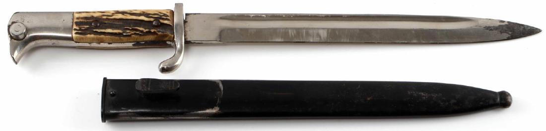 WWII GERMAN THIRD REICH POLICE BAYONET: German police bayonet. Unmarked 10" blade with stag grip. Some nickel loss present and scabbard some paint loss to scabbard. Fair overall.