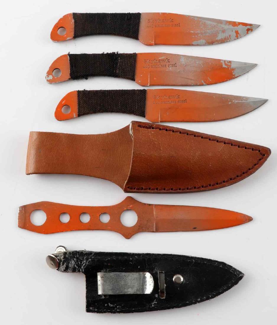 LOT OF 4 ORANGE THROWING KNIVES WITH 2 SHEATHS: Lot of 4 orange throwing knives with 2 sheaths . knives 6.5 Measures inches in length. In good used condition.