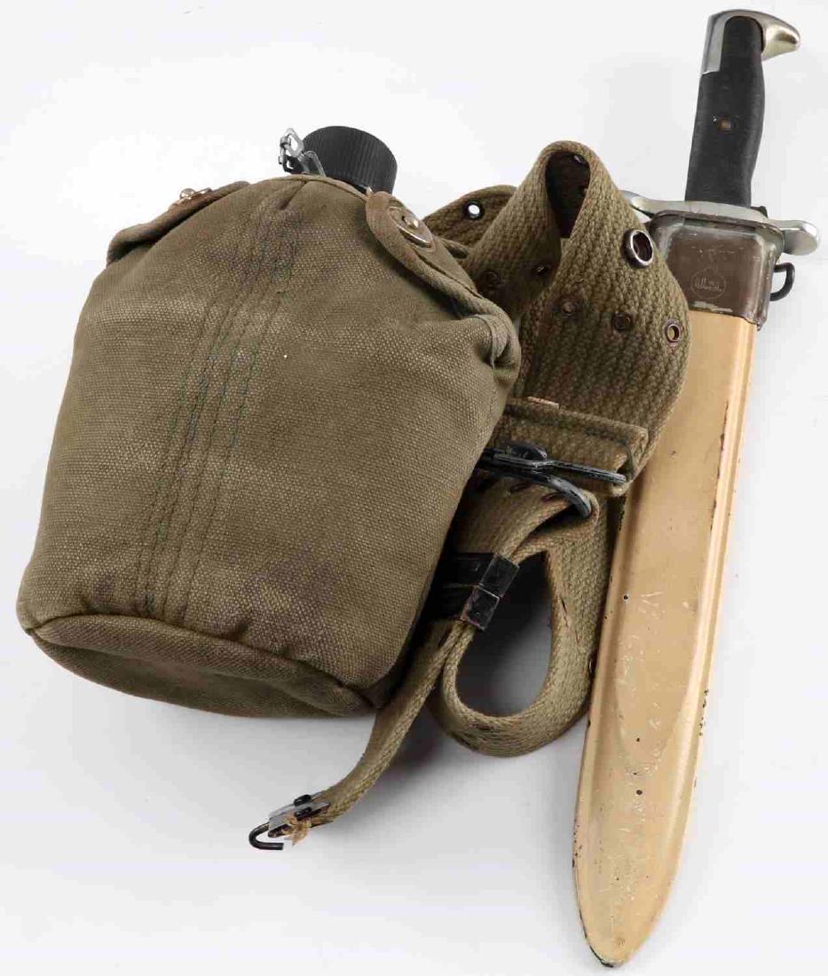 WWII US ARMY M1 GARAND BAYONET & WEB BELT LOT: Pal made WWII US M1 Garand bayonet. 10" uncut parkerized blade with black bakelite grips. Marked "Pal" over "US" with ordinance escutcheon on ricasso and marked "H" on pommel. Comes with cream painted