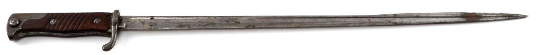 WWI IMPERIAL GERMAN M 1898 QUILBACK SWORD BAYONET: Sword bayonet for use with the 8 mm. Mauser Gewehr 98. Made famous during the first world war. Slender "quilback" blade. Marked "90. R. 10. 185." on its guard and "Simpson & Co Suhl" on its ricasso. G