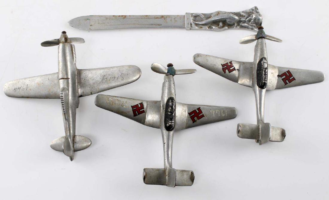 WWII US MADE SICILY PLANE MODEL AND KNIFE LOT: Lot contains three model German airplanes and a knife all made of what appears to be scrap aluminum. Two models are of Ju-87 Stuka dive bombers, one with one wheel remaining and a bomb slung underneat