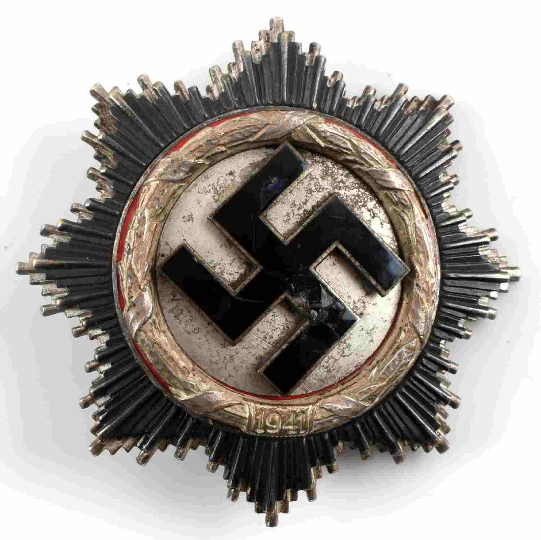 WWII THIRD REICH GERMAN CROSS IN SILVER: German Cross in Silver. Introduced on September 28th 1941. Complex layered multi-piece construction. Marked 20 on the underside of the pin for the Zimmermann company. Good condition overall. Enamel on