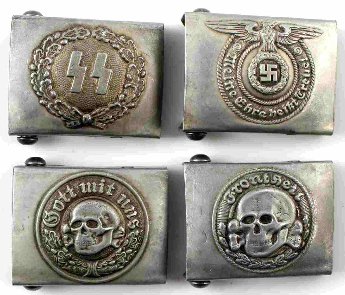 WWII GERMAN THIRD REICH WAFFEN SS BELT BUCKLE LOT: Lot of four SS belt buckles. Includes Waffen SS, sig runes, and two different patterns of Totenkopf. All have RZM marks. In very good condition. Unauthenticated/Sold 'as is' This lot has a reserve.