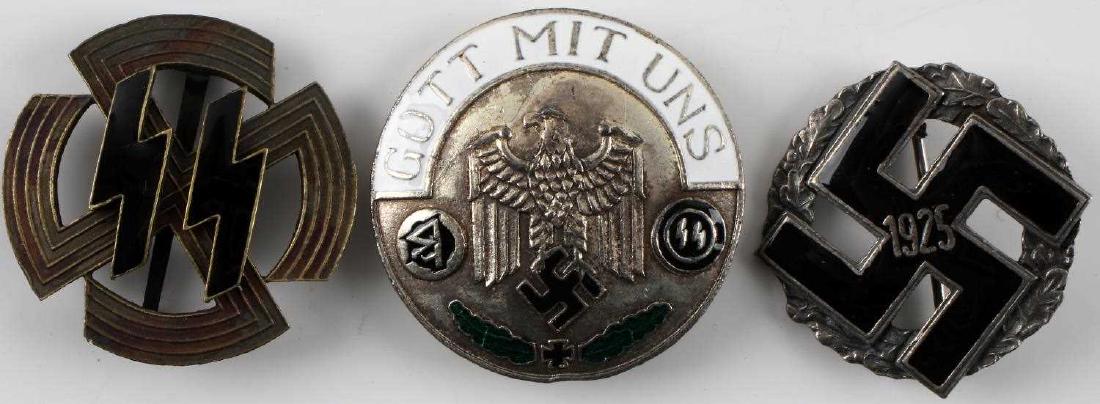 WWII GERMAN SS & GAU HONOR BADGE LOT OF 3: This lot includes 1 NSDAP 1925 Gau honor badge, 1 SS proficiency badge, and 1 Gott Mit Uns badge. Badges vary in condition slightly but are good overall. Reverse of gau badge is marked "Munchen 9". Un