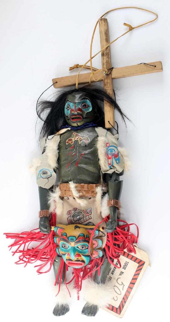 PACIFIC NORTHWEST INDIAN PUPPET PAINT WOOD POTLACH: Hand-carved and painted articulated wooden puppet. Mask face, leather and fur accents, holding a miniature hand-carved mask, horse hair, signed R. Collins to back of shawl. A Hamilton Caravan Tours ti