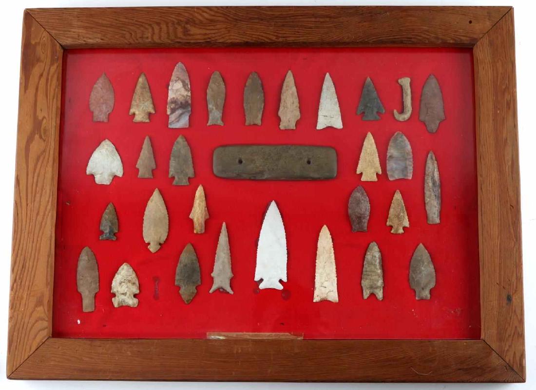 NATIVE AMERICAN ARCHAIC ARROWHEAD LOT OF 30: This lot features 28 Native American archaic era arrowheads, 1 fish hook, and 1 6" gorget. Items are in display box. Good variety of points.