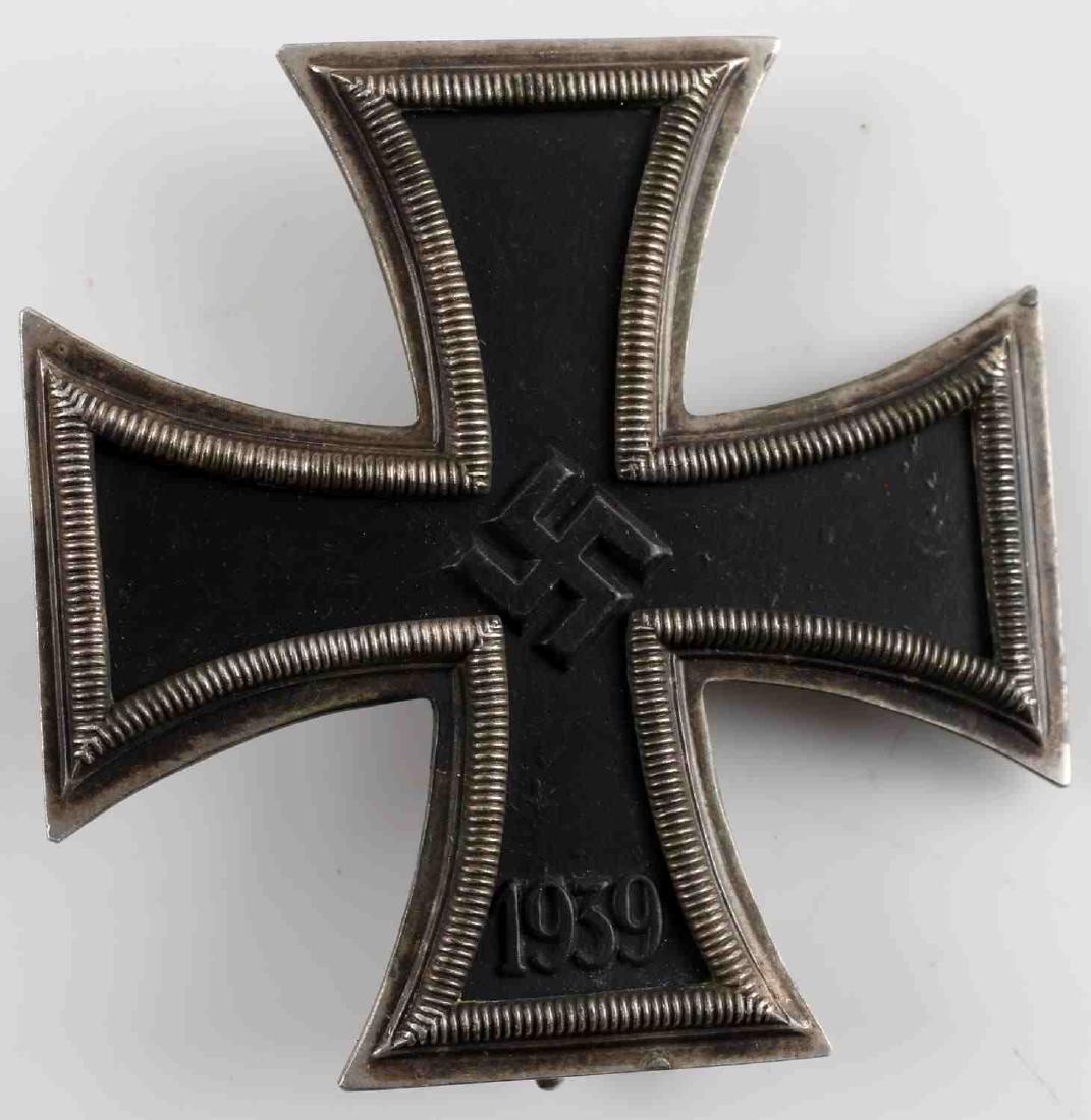WWII GERMAN THIRD REICH FIRST CLASS IRON CROSS: German Schinkel type Iron Cross 1st class. Smaller framed before standardization. Cross has WWI version reverse pin and is marked L/11 800. Frames of 800 silver with magnetic iron center. type Iron Cr