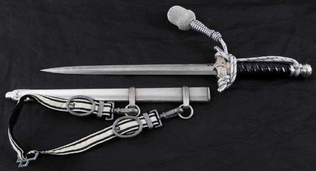 WWII GERMAN THIRD REICH BAHNSCHUTZ MODEL 2 DAGGER: Second Model Bahnschutz dagger. Eickhorn maker mark on the back of the blade. Nickel finish of the back and ends of the crossguards has slight wear, as well as the breast of the eagle. Black celluloid