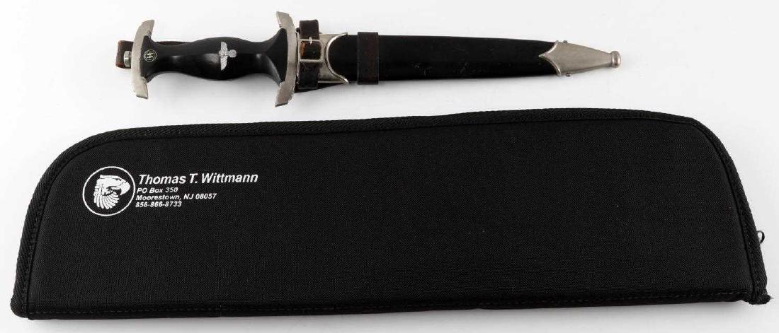 WWII GERMAN 1933 WAFFEN SS DAGGER CARL EICKHORN: 1933 German SS dagger by Carl Eickhorn with double trademark. (RZM 941/37/SS and squirrel holding sword trademark.) Complete with black leather vertical hanger and belt loop. Very good condition and a
