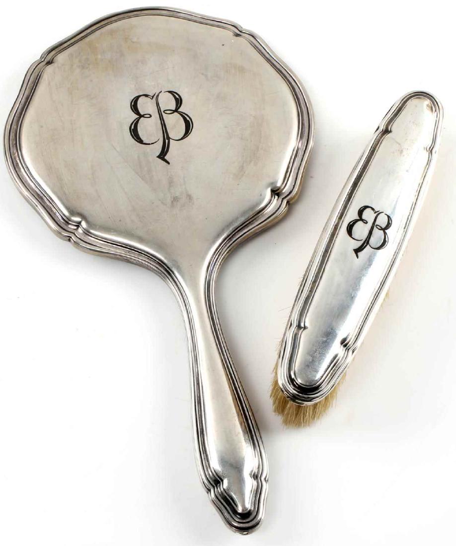 WWII GERMAN EVA BRAUN SILVER BRUSH & MIRROR LOT: This lot includes 1 marked 835 silver mirror and 1 835 marked silver brush. Both bear the butterfly "EB" monogram of Eva Braun and are etched and darkened at their bottoms. Near excellent condition ov