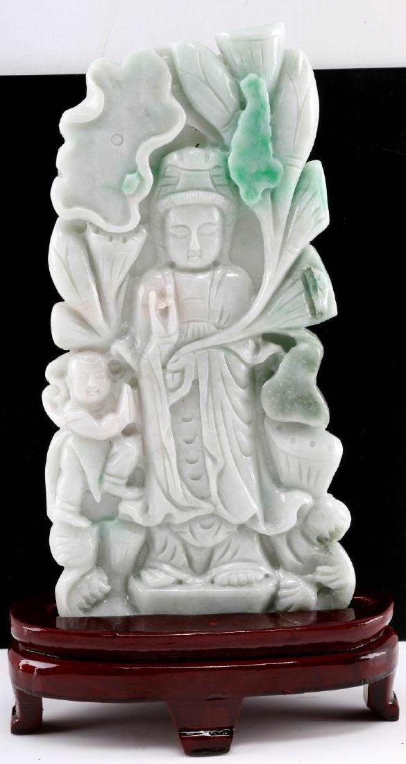 WHITE & GREEN SOAPSTONE CHINESE BUDDHA SCULPTURE: Sculpture of a standing buddha made of a white and green soapstone. Has sections which are very thin and translucent. Measures 13 inches high on the wooden pedestal. In very good condition overall. Ha