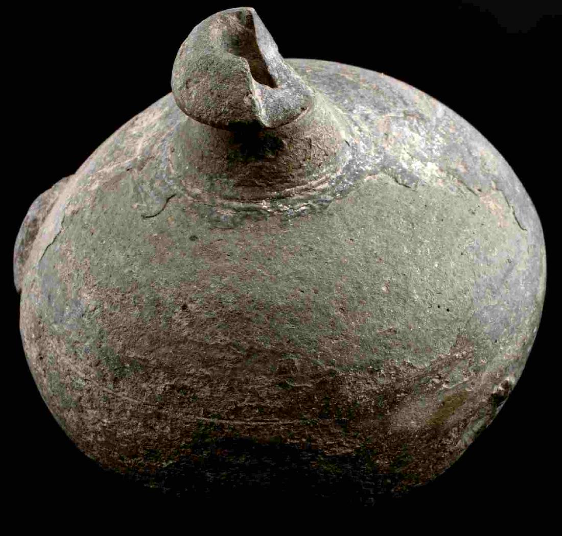 ANCIENT BYZANTINE GREEK FIRE GRENADE: Circa 700-900 AD clay Byzantine Greek fire grenade. A hollow ceramic vessel with barrel-shaped body, domed top, and conical base. The body has a faint latticework design. Chipped and broken in a few p