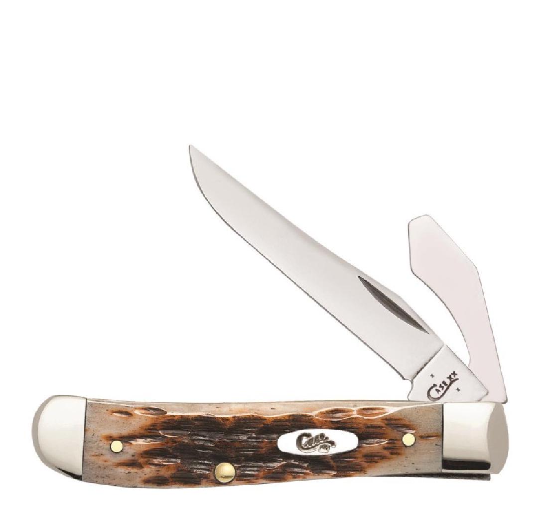 CASE XX AMBER BONE MINI TRAPPER W CAP LIFTER KNIFE: CASE XX MINI TRAPPER PEACH SEED AMBER HANDLE KNIFE W CAP LIFTER. No.03006. Item is an authenticated and licensed product of Case XX manufacturing. This lot has a reserve.