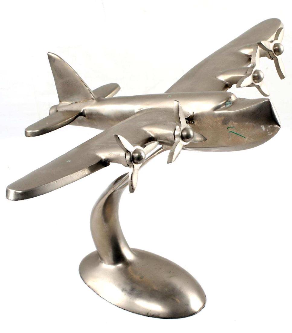 PEWTER PRIVATEER MODEL PLANE ON STAND ONE PIECE: Metal plane on stand, one piece. Measures 10 inches tall and 14.5 inch wingspan. Very good condition. Unmarked.