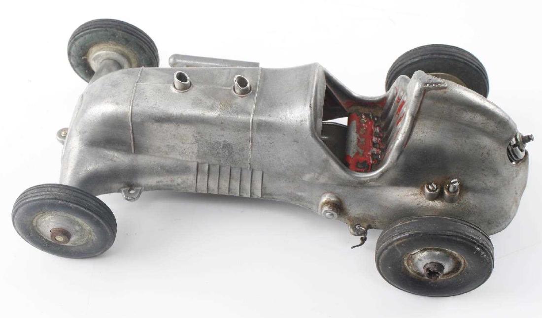 ROY COX THIMBLE DROME SPECIAL CAST METAL CAR: Made in Santa Ana, CA. Metal car with some interior paint missing. Maker marked to bottom. Measures 8.5 inches long. Good condition.