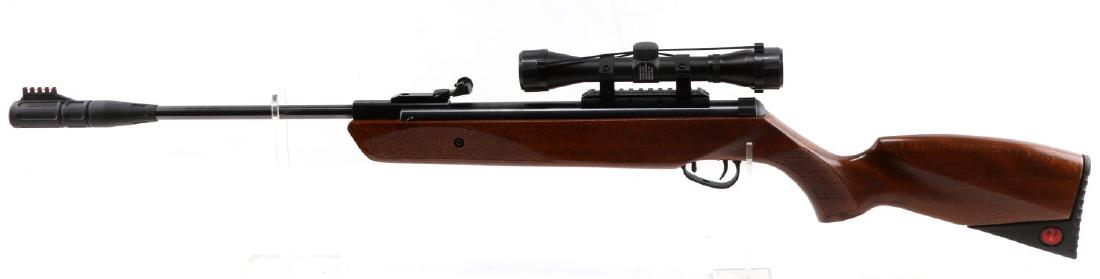 RUGER IMPACT MAX UMAREX .22 CAL AIR PELLET RIFLE: Features wood stock, blued steel barrel, maker marks to left side, neon sights, hard rubber butt with Ruger emblem to each side, 4 X 32 Umarex scope attached. Very good condition.
