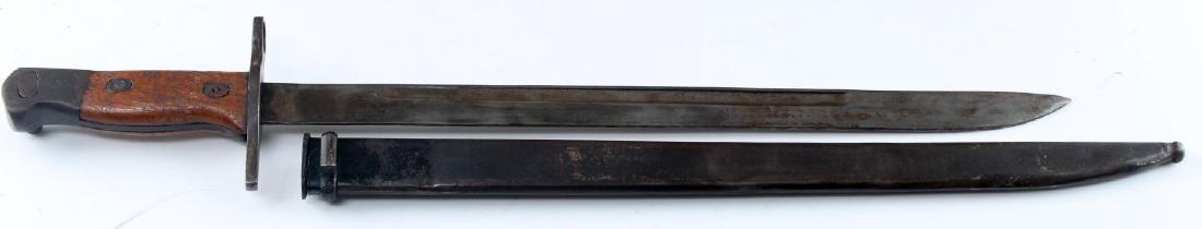 WWII IMPERIAL JAPANESE ARISAKA BAYONET & SCABBARD: WWII Japanese Imperial Arisaka Bayonet with scabbard and wooden handle and working button mechanism. Measures 20.5 inches long inside of scabbard, fullered blade bears pitting and patination consisten