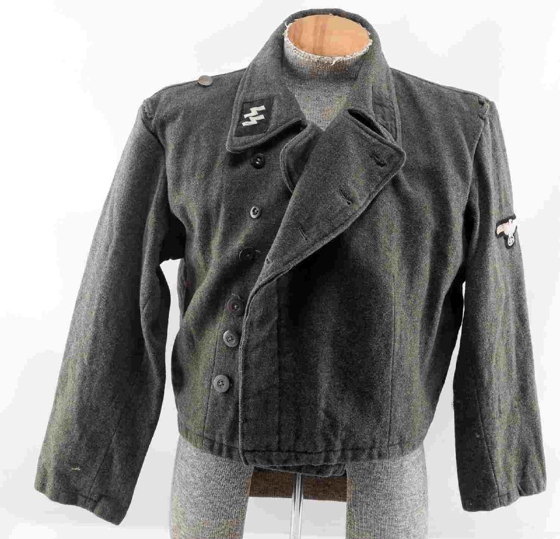 WWII GERMAN THIRD REICH REPRODUCTION SS TUNIC: Reproduction SS tunic . Double breasted with wool exterior and cloth interior. Has SS and Reichsadler patches. Interior is stamped with numbers and sig runes. Good overall. Some buttons have been repl