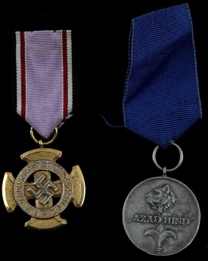 WWII GERMAN THIRD REICH MEDAL LOT OF TWO: Lot contains two medals from the Third Reich, one a service decoration for the Luftschutz, while the other is an Indian Legion medal. Both are in very good condition. Unauthenticated/Sold 'as is'.