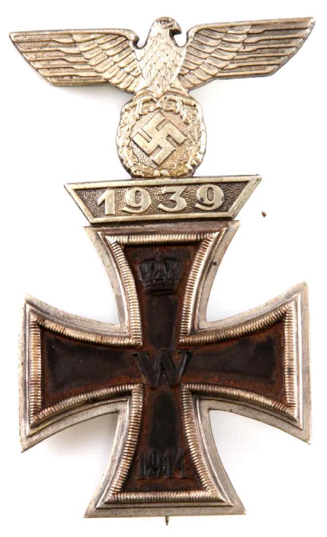 WWI WWII IMPERIAL GERMAN THIRD REICH IRON CROSS: A WWI Iron Cross with a WWII Iron Cross spange affixed to the top. In very good condition. Iron magnetic construction with silver content. Marked 800 on the back. Has a single clasp which runs from th