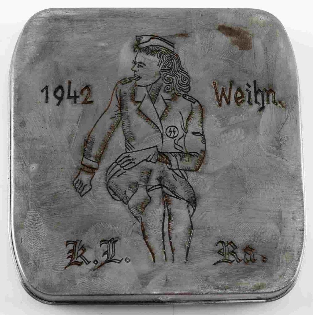HOLOCAUST PERIOD RAVENSBRUCK CIGARETTE CASE: From the female concentration camp Ravensbruck, etched design to front, measures 3.75 X 3.5 inches. Some oxidized scratches to inside. Unauthenticated, sold as is. This lot has a reserve.