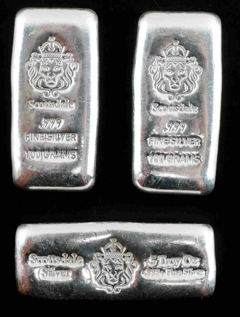 SCOTTSDALE .999 FINE SILVER 3 BAR 11.4 OZT TOTAL: Lot contains three cast bars of .999 fine silver from Scottsdale. Includes one bar which weighs 5 troy ounces and two bars which weigh 100 grams. Total silver weight is about 355.5 grams or 11.43 ozt.