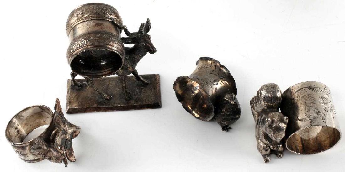 LOT 4 ANTIQUE SILVER PLATE DECORATIVE NAPKIN RINGS: Four Victorian silver plate ornate napkin rings. One incised with design and with small bird next to ring. In very good condition. One with incised floral decoration and initials "GL" with squirrel at
