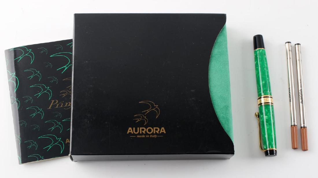 VINTAGE AURORA PRIMAVERA ROLLER BALL PEN W BOX: Italian made green and gold roller ball pen, No. 2231 with 14K gold nib and ebony feed, comes with two cartridges in original box with manual. Excellent condition.