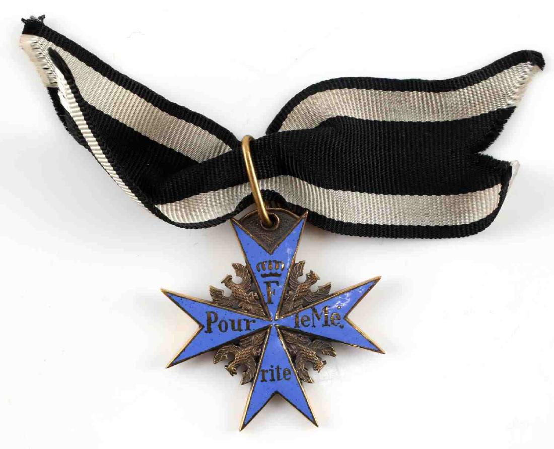 PRUSSIAN POUR LE MERITE PRINZEN SIZE CIVILIAN WEAR: Small size copy of the Prussian Pour le Merite medal for civilian wear. Hanger is marked "JGUS" for Godet. Cross measures 1.25 inches square. In very good condition. This lot has a reserve.