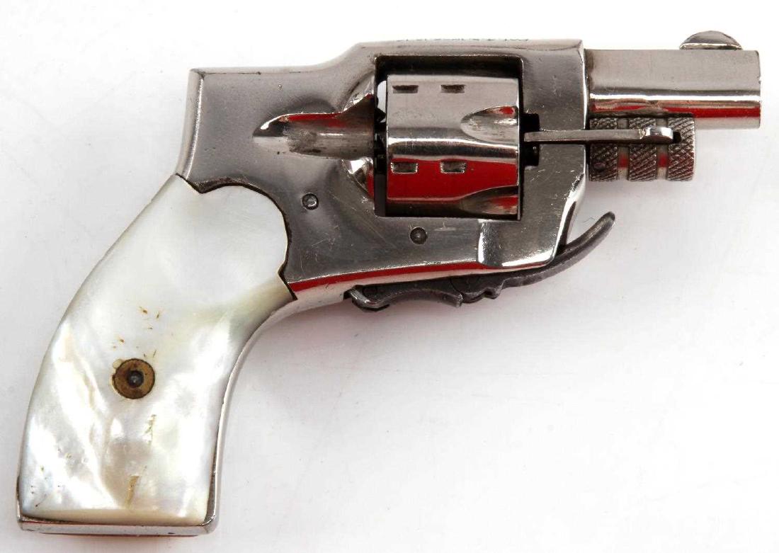SEDGLEY BABY HAMMERLESS 1920'S REVOLVER .22 PEARL: Nickel finish with patent dates 4.5.10 - 2.13.17 Baby Hammerless marked to top. Model is worn off. 6 shot revolver in .22 caliber with fold down trigger. Pearl grips. Barrel measures 1 3/8 inches with