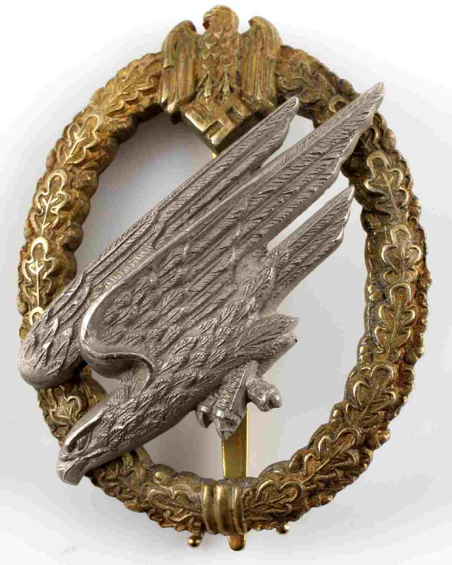 WWII GERMAN THIRD REICH ARMY PARATROOPER BADGE: German Army Fallschirmjager badge. 1st Pattern made from 800 silver with pin safety catch unique to this type of badge. Hand engraved to an officer in a Fallschirmjager infantry battalion. Nice high-d