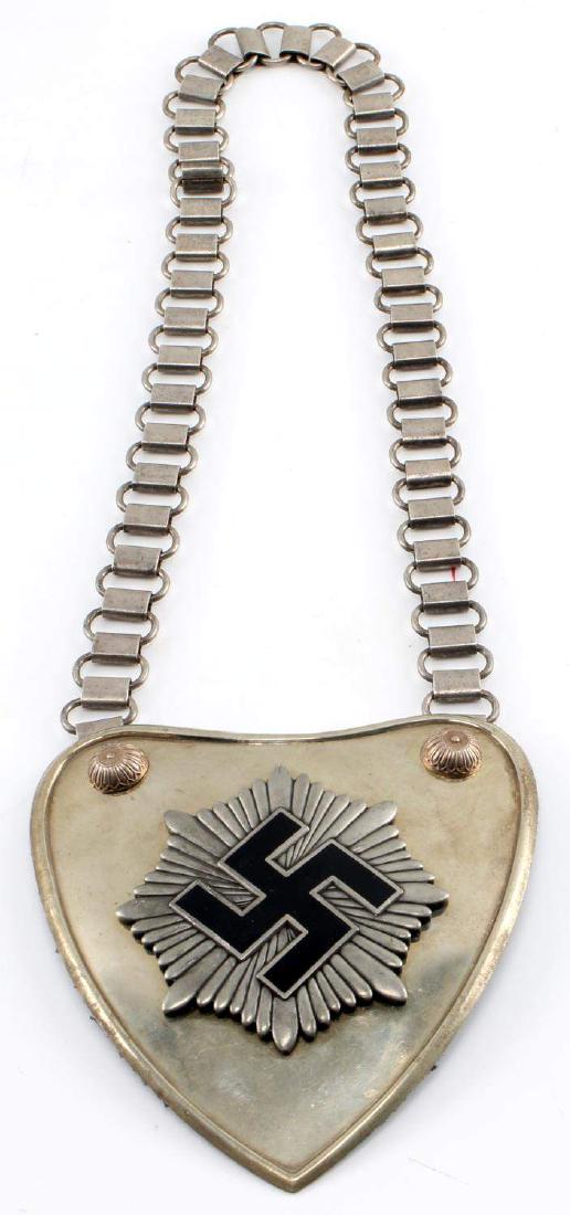 WWII GERMAN THIRD REICH REICHSLUFTBUND GORGET: 2nd pattern Reichsluftbund gorget. Heavy nickel silver construction. Complete with correct chain. In very good condition with some age and wear. Unauthenticated/Sold 'as is' This lot has a reserve.
