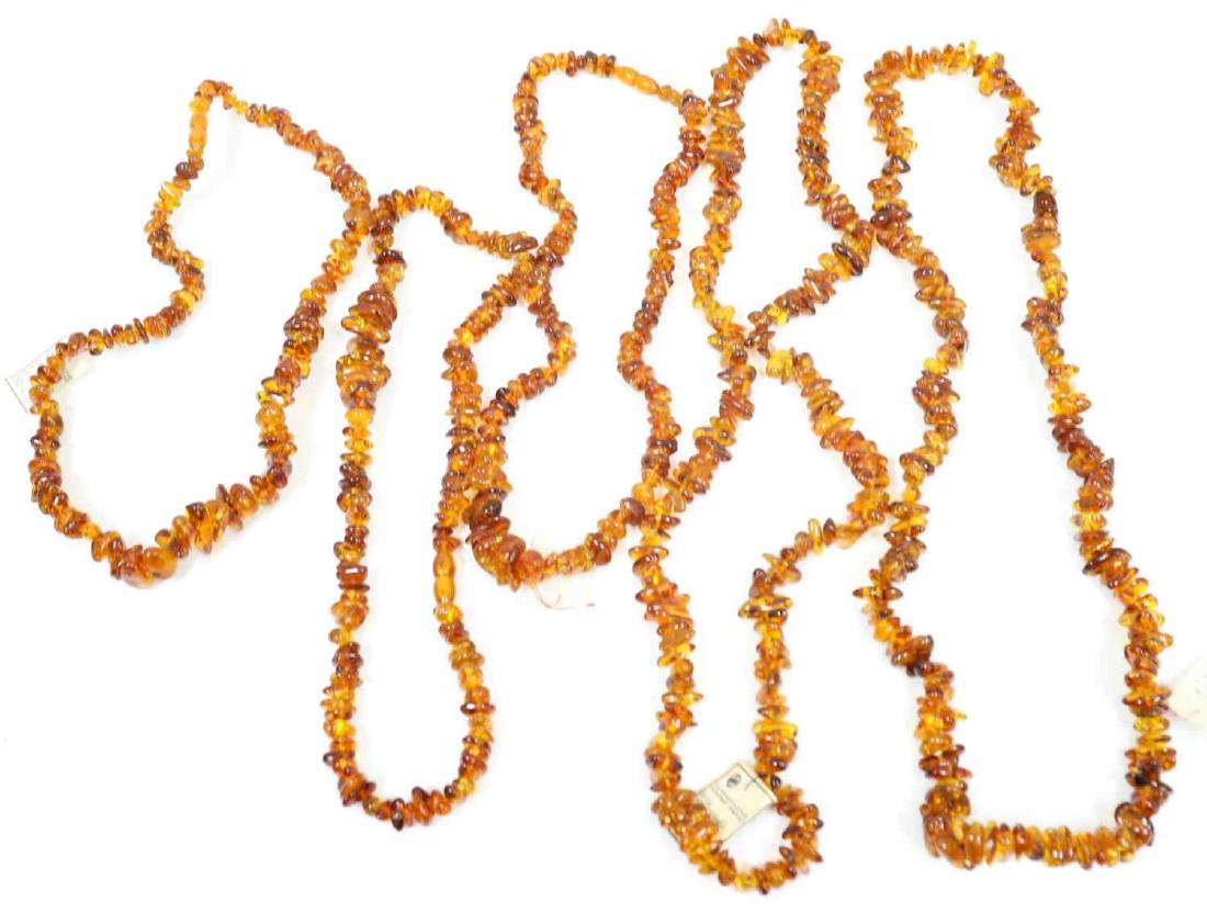 5 SOVIET KALININGRAD AMBER BEAD NECKLACE LOT: Lot of five (5). Some include tags from the Soviet Kaliningrad amber factory, which are 30-40 years old. Three measure approx. 26 inches (end to end), two larger ones measure 18 inches (round measure)