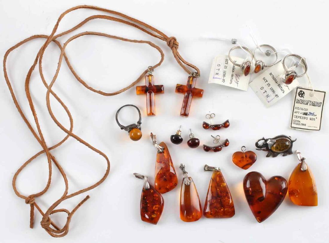 18 PIECE SOVIET SILVER & AMBER JEWELRY LOT: Group of eighteen (18) pieces. Includes seven pendants, two crosses, two pair of earrings, one brooch, and three rings (3 measuring 7.5, and one measuring 8.5). Each piece is silver marked. All in goo