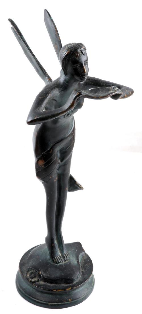UNSIGNED BRASS FAIRY STATUETTE HOLDING BOWL: Fairy stands on toes and leans over looking at small bowl. Small decorative flowers in areas. Brass has faux bronze patina. Some chips to faux patina. Measures 12.5 inches tall.