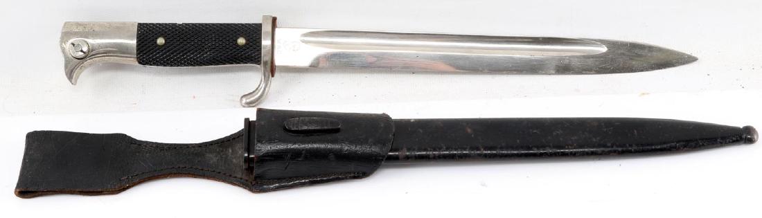 MARKED K98 MAUSER DRESS SCABBARD BAYONET W FROG: WKC maker marked K98 Mauser rifle dress bayonet with scabbard and black leather frog. Item is in good condition considering the age of this WWII item.
