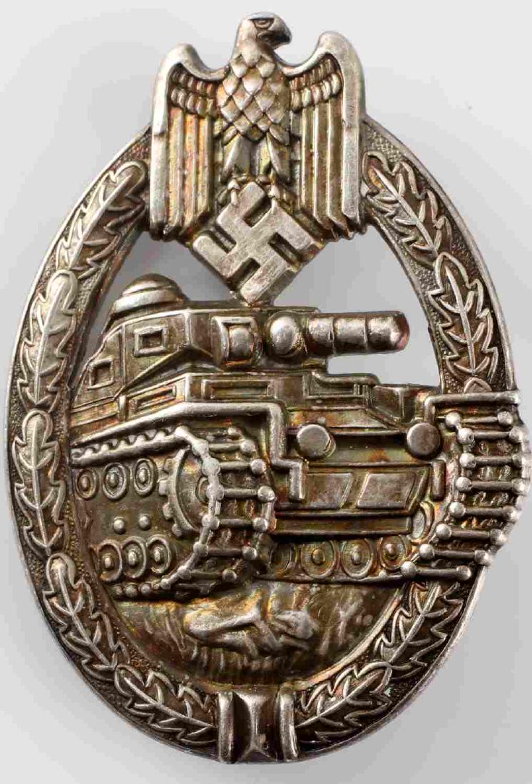WWII GERMAN THIRD REICH PANZER ASSAULT BADGE: German Panzer Assault badge in silver. Hollow stamp construction with unmarked reverse. Thin vertical pin back. Very good condition with nice patina and great detail retention.