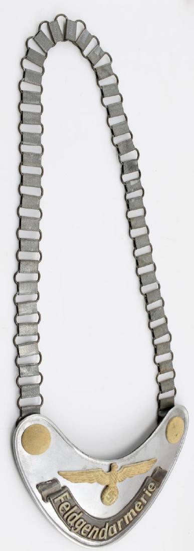 WWII GERMAN 3RD REICH HEER FELDGENDARMERIE GORGET: German Army Feldgendarmerie gorget with chain. RZM marked on back hook. In very good condition. Unauthenticated/Sold 'as is'