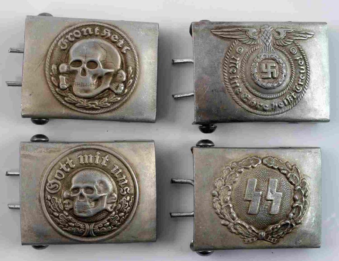 WWII GERMAN THIRD REICH SS BELT BUCKLE LOT OF FOUR: Lot contains four SS belt buckles. Includes standard, one with runes, and two different patterns of Totenkopf forms. All are RZM marked. In very good condition. Unauthenticated/Sold 'as is' This lot h