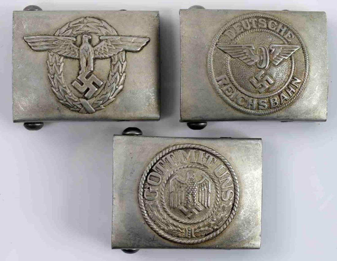 WWII GERMAN THIRD REICH BELT BUCKLE LOT OF THREE: Lot contains three German belt buckles. Includes Kriegsmarine, Deutches Reichsbahn, and police. All have RZM marks. In very good condition. Unauthenticated/Sold 'as is' This lot has a reserve.