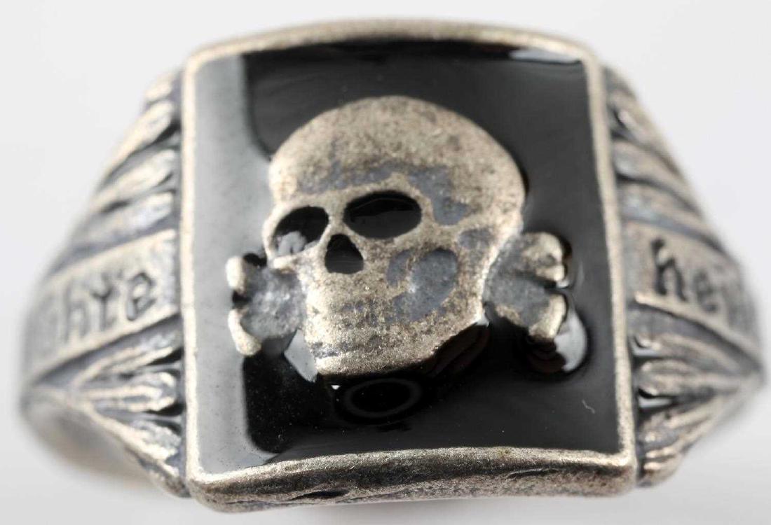WWII GERMAN THIRD REICH SS TOTENKOPF SILVER RING: Silver ring with the Totenkopf crest in the center and "Meine Ehre Heist Treue" slogan along the side. Has 800 silver mark.. Weighs 5.8 grams. In very good condition. This lot has a reserve.