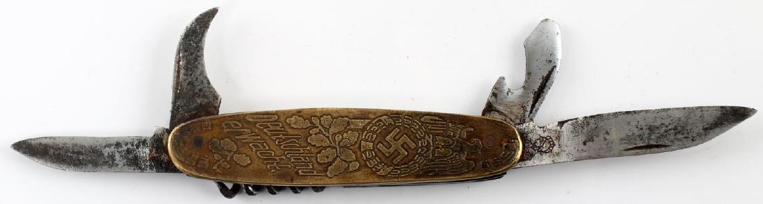 WWII GERMAN THIRD REICH SOLINGEN POCKET KNIFE: German Solingen multi-blade pocket knife with etched Reichsadler, oak leaves, and the words "Deutschland erwacht." Blade has stylized knight motif of WKC on blade. Good condition overall. Some corrosi