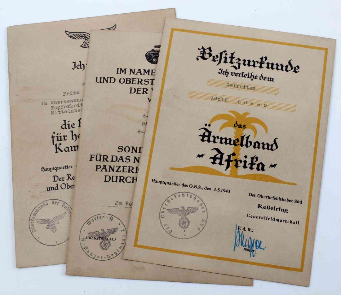 WWII GERMAN 3RD REICH MILITARY AWARD DOCUMENT LOT: Lot contains three German award documents. One is a Luftwaffe Honor Goblet document with the printed signature of Hermann Goring, one for a Panzer honor cord, and one for an "Afrika" cuff title. In ve